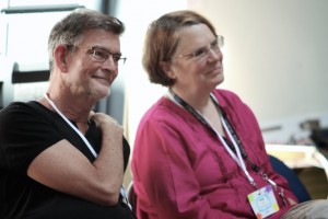 Partners for Youth Empowerment founders Peggy Taylor and Charlie Murphy happily watching an activity together